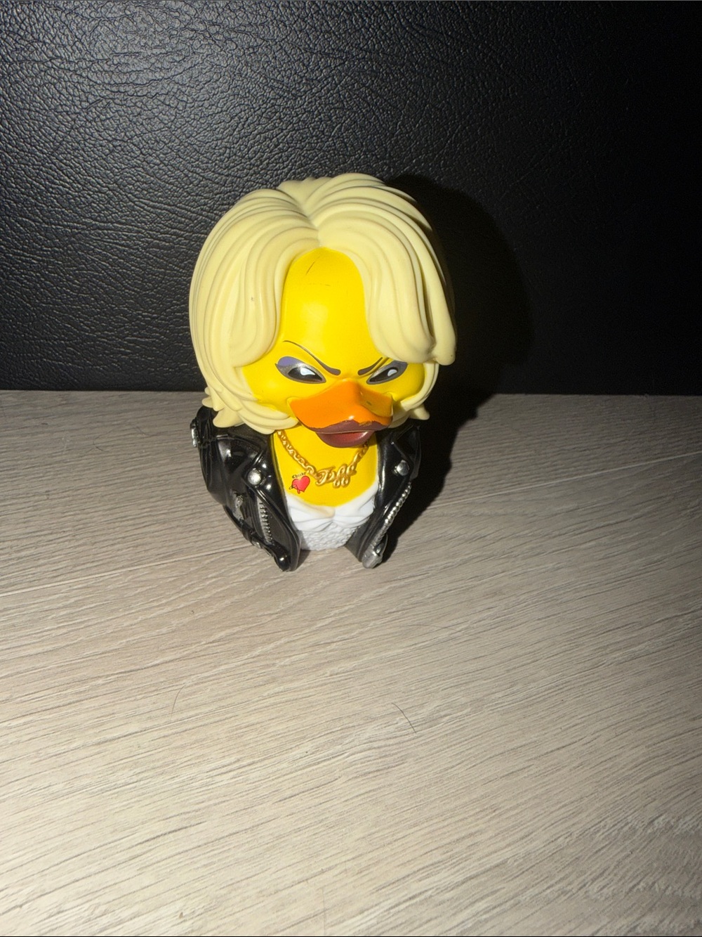 Duck Head Yellow Rocker Duck with Blonde Hair and Black Jacket